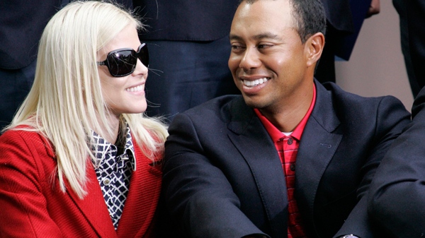 Tiger Woods, right, is joined by wife, Elin Nordegren, at the closing ceremonies for the Presidents Cup in San Francisco, Calif., on Oct. 11, 2009. (AP / Scot Tucker)