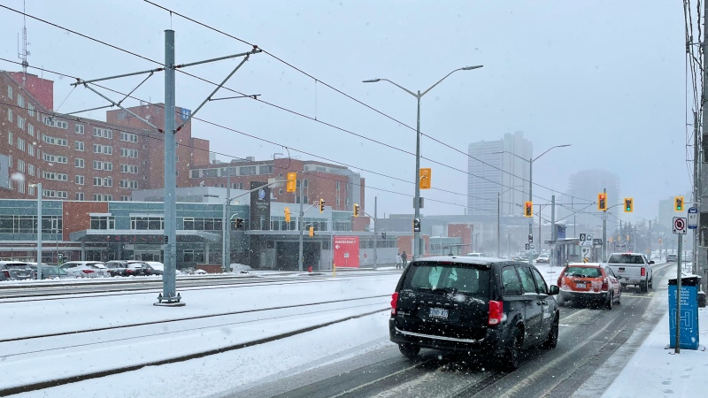 Vehicles drive through a slushy mix of precipitation in Kitchener on Tuesday, March 15, 2022. (Alison Sandstrom/CTV Kitchener)