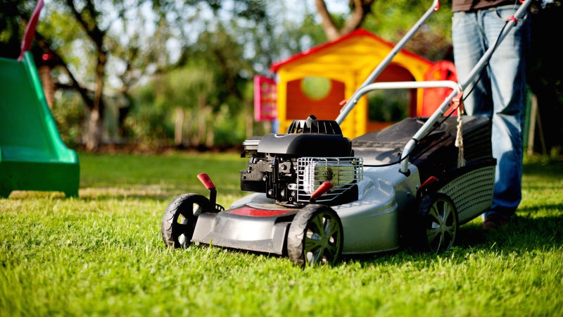 A lawn mower can be seen in a garden in this file photo. (Dreamstime/Alex Loban)