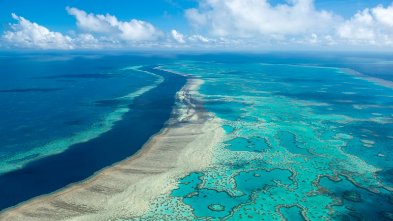 In this undated photo provided by the Great Barrier Reef Marine Park Authority, the Great Barrier Reef near the Whitsunday, Australia, region is viewed from the air. (Jumbo Aerial Photography/Great Barrier Reef Marine Park Authority via AP) 
