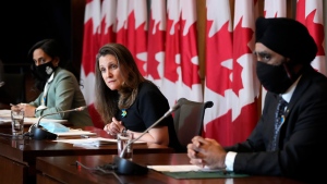 Deputy Prime Minister and Minister of Finance Chrystia Freeland, centre, is joined by Minister of National Defence Anita Anand and Minister of International Development Harjit Sajjan, right, during a media availability to discuss Canadian sanctions on Russia, as Russia continues to invade Ukraine, in Ottawa, on Tuesday, March 1, 2022. (THE CANADIAN PRESS/Justin Tang)