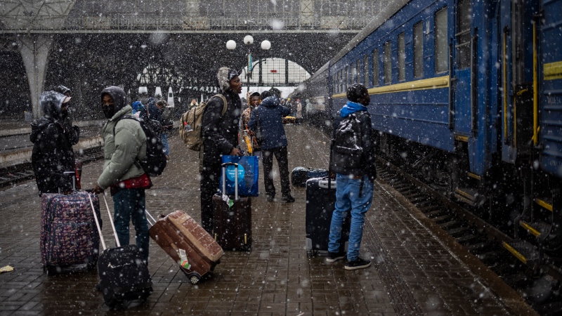 Nigerian students in Ukraine wait at the platform in Lviv railway station, Feb. 27, 2022, in Lviv, west Ukraine. Jarred by discriminatory treatment and left to evacuate themselves from Ukraine, people from African, Asian and Latin American countries who succeed in getting out are forming impromptu networks to help thousands of others hoping to flee. (Bernat Armangue/AP Photo, File)