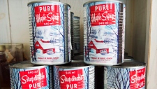 Maple syrup cans are seen at a sugar shack on February 10, 2017 in Oka, Quebec. THE CANADIAN PRESS/Ryan Remiorz