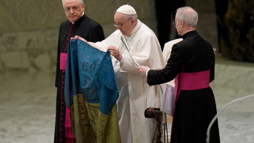 Pope Francis holds a Ukraine flag