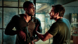 This image released by Universal Pictures shows Yahya Abdul-Mateen II and Jake Gyllenhaal in a scene from "Ambulance." (Andrew Cooper/Universal Pictures via AP)