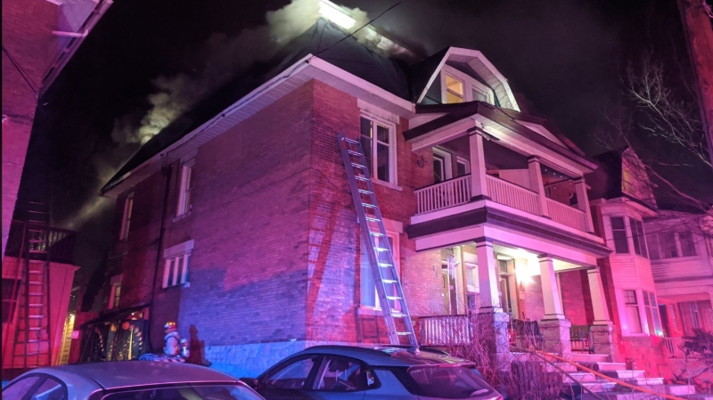 Ottawa firefighters battle a blaze at a home on Fifth Avenue between Bank Street and Howick Place Sunday night. (Scott Stilborn/Ottawa Fire Services)