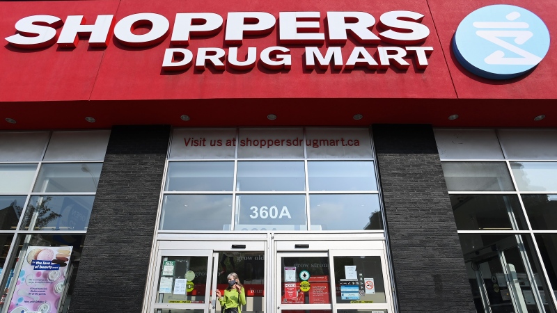 People leave a Shoppers Drug Mart in Toronto on Friday, September 25, 2020. THE CANADIAN PRESS/Nathan Denette
