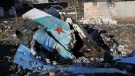 Fragments of a Russian jet fighter on a private house in Chernihiv, Ukraine, April 6, 2022. (AP Photo/Stas Yurchenko)