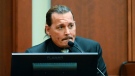 Actor Johnny Depp testifies during a hearing at the Fairfax County Circuit Court in Fairfax, Va., Tuesday April 19, 2022. Depp sued his ex-wife Heard for libel in Fairfax County Circuit Court after she wrote an op-ed piece in The Washington Post in 2018 referring to herself as a "public figure representing domestic abuse." (Jim Watson/Pool Photo via AP) 