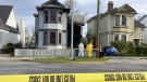 Investigators at the scene of the blaze at 1112 Caledonia Ave. on Wednesday, April 20, 2022. (CTV News)