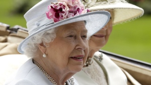 Queen Elizabeth II arrives at the parade ring with Princess Alexandra in a horse-drawn carriage on the second day of the Royal Ascot horse race meeting in Ascot, England, June 20, 2018. (AP Photo/Tim Ireland)