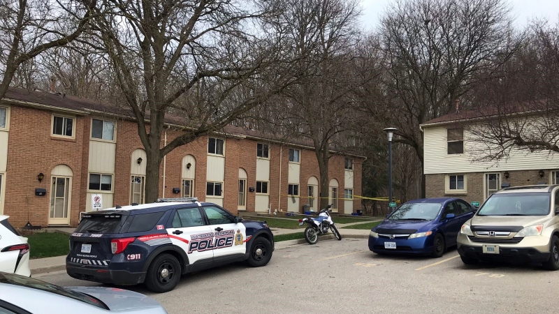 A police car is seen at a townhouse complex on Green Valley Drive in Kitchener on April 25, 2022. (Chris Thomson/CTV Kitchener)