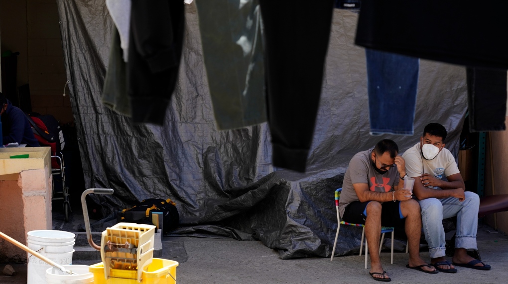 Men waiting at a migrant shelter in Mexico