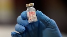A vial of the Moderna COVID-19 vaccine is displayed at a pop-up vaccine clinic for EMS workers Center in Salt Lake City on January 5, 2021. Yukon Community Services Minister John Streicker says a Vancouver couple accused of flying to a remote Yukon community to get the COVID-19 vaccine will have to answer for their actions in a courtroom. THE CANADIAN PRESS/AP, Rick Bowmer
