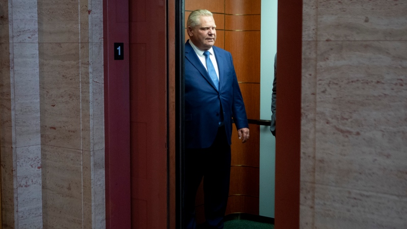 Ontario Premier Doug Ford makes his way to his office before his Government delivers the provincial 2022 budget at the Queens Park Legislature, in Toronto, on Thursday, April 28, 2022. THE CANADIAN PRESS/Chris Young 