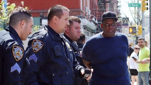 New York City Police Department officers arrest subway shooting suspect Frank James, 62, in the East Village section, of New York, Wednesday, April 13, 2022. (AP Photo/Meredith Goldberg, File)