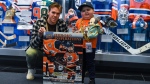 Ben Stelter was presented with his own official Oilers trading card by Connor McDavid on April 28, 2022. (Source: Edmonton Oilers)