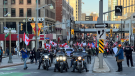 A group of people block Rideau Street at Sussex Drive on the opening night of the "Rolling Thunder Ottawa" event. (Jeremie Charron/CTV News Ottawa)