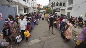 Sri Lankans queue up near a fuel station to buy kerosene in Colombo, Sri Lanka, April 12, 2022. (AP Photo/Eranga Jayawardena)