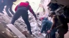 This frame taken from an undated video provided Sunday, May 1, 2022, by the Azov Special Forces Regiment of the Ukrainian National Guard shows people climbing over debris at the Azovstal steel plant, in Mariupol, eastern Ukraine. (Azov Special Forces Regiment of the Ukrainian National Guard via AP, File) 