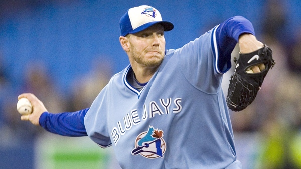 Then Toronto Blue Jays starting pitcher Roy Halladay throws against the Seattle Mariners during the first inning of a baseball game in Toronto on Sept. 25, 2009. (Fred Thornhill / THE CANADIAN PRESS)