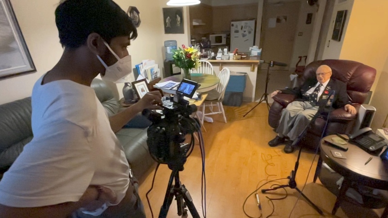 Rishi Sharma of California interviewing WW2 veteran Ron Moyes in Ottawa. (Dave Charbonneau/CTV News Ottawa)