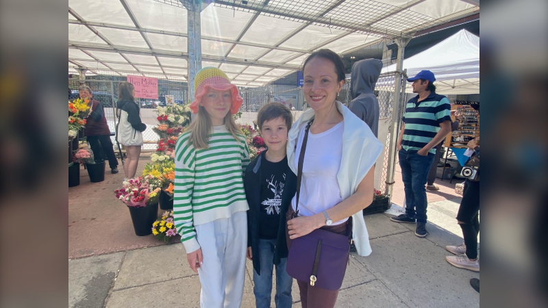 Anna Fedorova (right) spends Mother's Day in the ByWard Market with her two children after fleeing the war in Ukraine. (Natalie van Rooy/CTV News Ottawa)