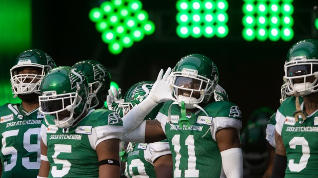 Saskatchewan Roughriders get ready to walk onto the field during the first half of CFL football action in Regina against the Hamilton Tiger-Cats on Saturday, August 14, 2021. THE CANADIAN PRESS/Kayle Neis