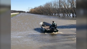 A boat travels through a flooded ditch in Red River Valley south of Winnipeg on May 10 (CTV News Photo Josh Crabb)