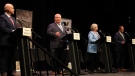 Ontario PC party leader Doug Ford makes a point at the Federation of Northern Ontario Municipalities debate at the Capitol Centre in North Bay, Ont. on Tuesday, May 10, 2022 as Liberal leader Steven Del Duca, NDP leader Andrea Horwath and Green Party leader Mike Schreiner look on. THE CANADIAN PRESS/Gino Donato