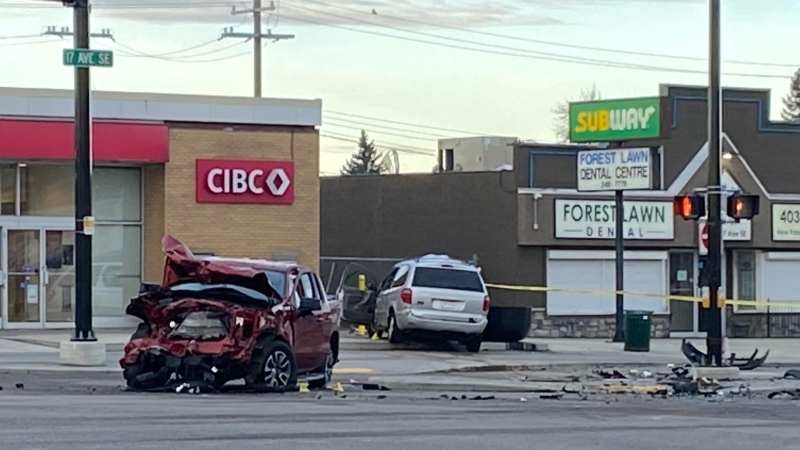 A damaged pickup truck and minivan, and a field of debris, following a Tuesday night crash and suspected shooting at the intersection of 17th Avenue and 36th Street S.E.