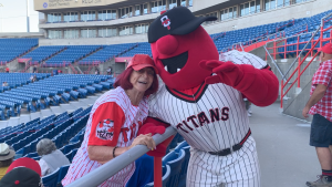 Season ticket holder Judi Haines poses with Ottawa Titans mascot, Cappy. (Jackie Perez/CTV News Ottawa)