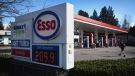 A sign displays the price of a litre of regular-grade gasoline at an Esso gas station in Vancouver, March 8, 2022. THE CANADIAN PRESS/Darryl Dyck