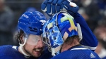 Toronto Maple Leafs forward Auston Matthews (34) celebrates with teammate Jack Campbell (36) after defeating the Tampa Bay Lightning during third period, round one, NHL Stanley Cup playoff hockey action in Toronto on Tuesday, May 10, 2022. THE CANADIAN PRESS/Nathan Denette