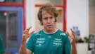 FILE - Formula 1 driver Sebastian Vettel speaks to young offenders during his visit to HMP Feltham to launch a new mechanics workshop for offenders aged 18 to 21 to help them gain formal qualifications, in London, Thursday May 12, 2022. (Yui Mok/PA via AP)