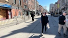 People wear masks on Ste. Catherine St. in Montreal's Gay Village. (Daniel J. Rowe/CTV News)