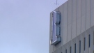 The canvas sign of the Richardson Building was damaged amid winds which gusted up to 82 kilometres per hour on May 13, 2022. (Source: CTV News Winnipeg)