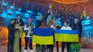 Kalush Orchestra from Ukraine stand on the stage after winning the Grand Final of the Eurovision Song Contest at Palaolimpico arena, in Turin, Italy, May 15, 2022. (AP Photo/Luca Bruno)