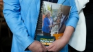 Ontario NDP leader Andrea Horwath holds her platform book after delivering her Ontario provincial election campaign platform in Toronto on Monday, April 25, 2022. THE CANADIAN PRESS/Nathan Denettel