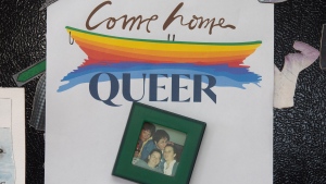 Gerry Rogers displays the "Come Home Queer" poster on the refrigerator at her home in Broad Cove, N.L., Saturday, May 14, 2022. THE CANADIAN PRESS/Paul Daly 
