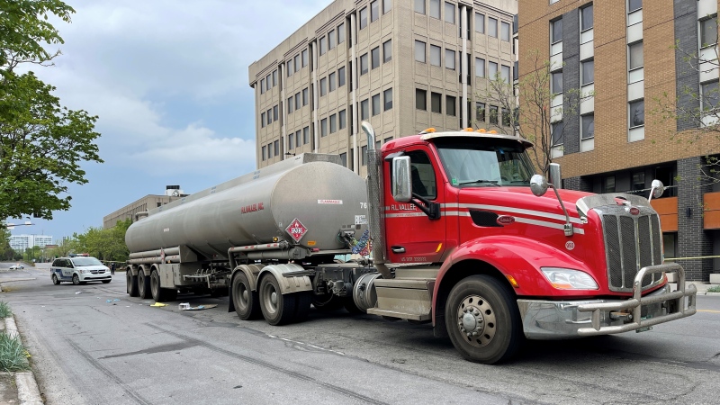 A man in his 30s is in critical condition in the hospital after being hit and dragged by a tanker truck in Montreal. (Luca Caruso-Mora/CTV News)