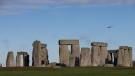 In this Dec. 17, 2013, file photo, visitors take photographs of the world heritage site of Stonehenge, in Wiltshire England. (AP Photo/Alastair Grant, File)