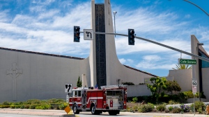 A firetruck is seen outside the Geneva Presbyterian Church in Laguna Woods, Calif., on Sunday, May 15, 2022 after a fatal shooting. (Leonard Ortiz/The Orange County Register via AP)