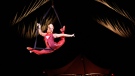 An artist performs on aerial straps during a preview of the Cirque du Soleil show "Kooza" in Montreal on Tuesday, May 10, 2022. THE CANADIAN PRESS/Paul Chiasson