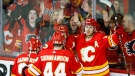 Calgary Flames forward Matthew Tkachuk, right, celebrates his goal with teammates during second period NHL playoff hockey action against the Dallas Stars in Calgary, Alta., Sunday, May 15, 2022 (The Canadian Press/Jeff McIntosh).