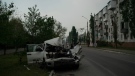 A heavily damaged car is seen on a street after a Russian attack in Severodonetsk, Luhansk region, Ukraine, on May 13, 2022. (Leo Correa / AP)