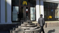 A man walks past a McDonald's restaurant closed to visitors in St. Petersburg, Russia, on March 15, 2022. (AP) 