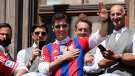 Bayern's Robert Lewandowski gestures to supporters as he stands on the balcony of the town hall at Marienplatz square celebrating the 31th Bundesliga title at the German Bundesliga in Munich, Germany, May 15, 2022. (AP Photo/Matthias Schrader)