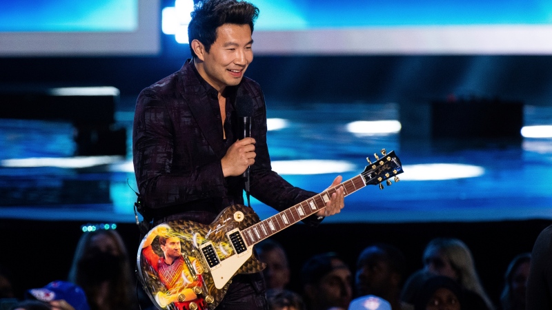 Simu Liu appears on stage at the JUNO Awards on Sunday, May 15, 2022, at the Budweiser Stage in Toronto. (Photo by Arthur Mola/Invision/AP)