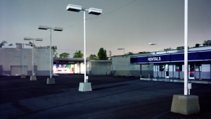 An empty parking lot is shown at a car rental business. (Getty Images) 